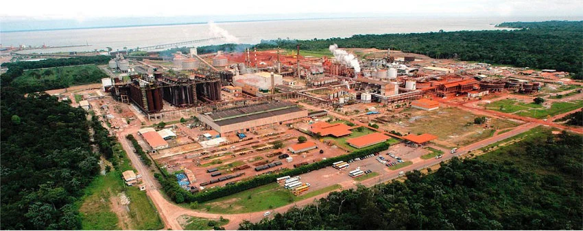 Real photograph of a comparable industrial aluminum smelter facility